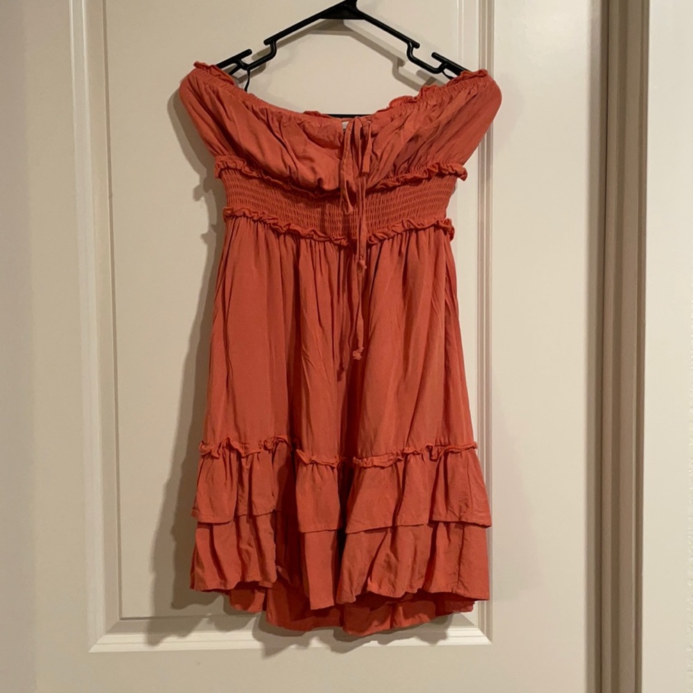 Burnt orange, strapless dress.